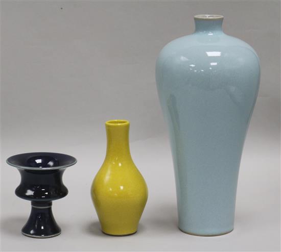 A Chinese blue-glazed stem cup, a yellow vase and a claire de lune glazed meiping